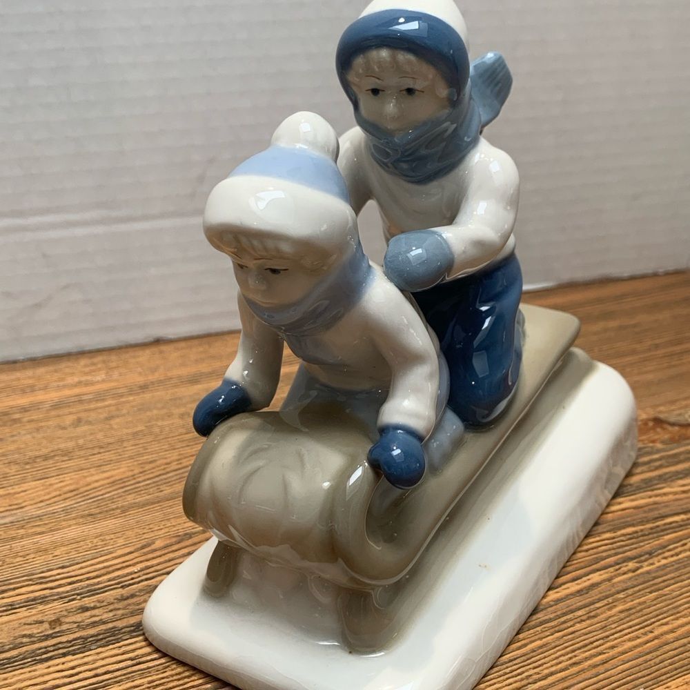 Winter Adventure Ceramic Figurine - Blue and White